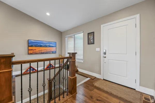 Large, welcoming foyer with lovely open stairway.