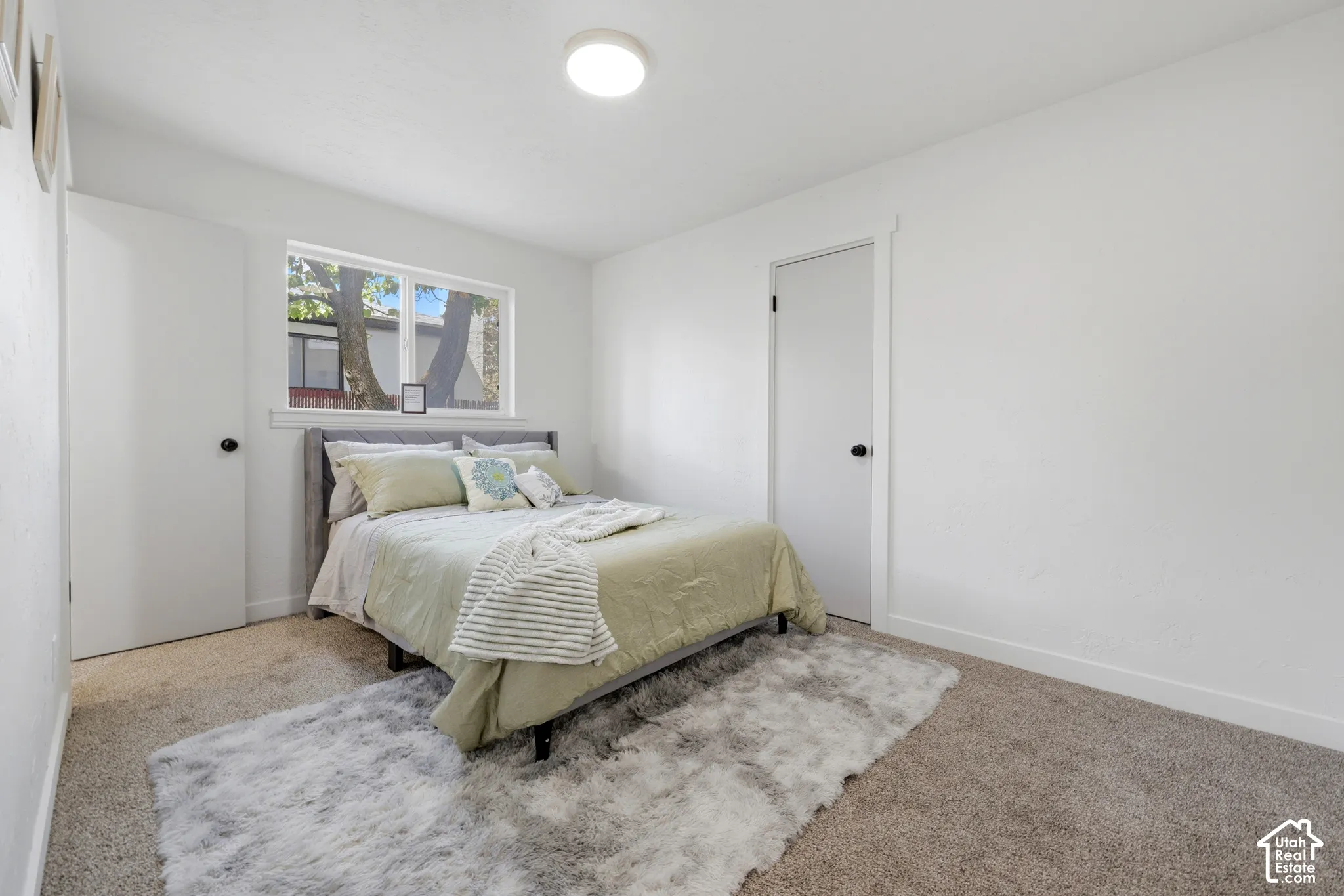 Recessed lighting and a window offering natural illumination