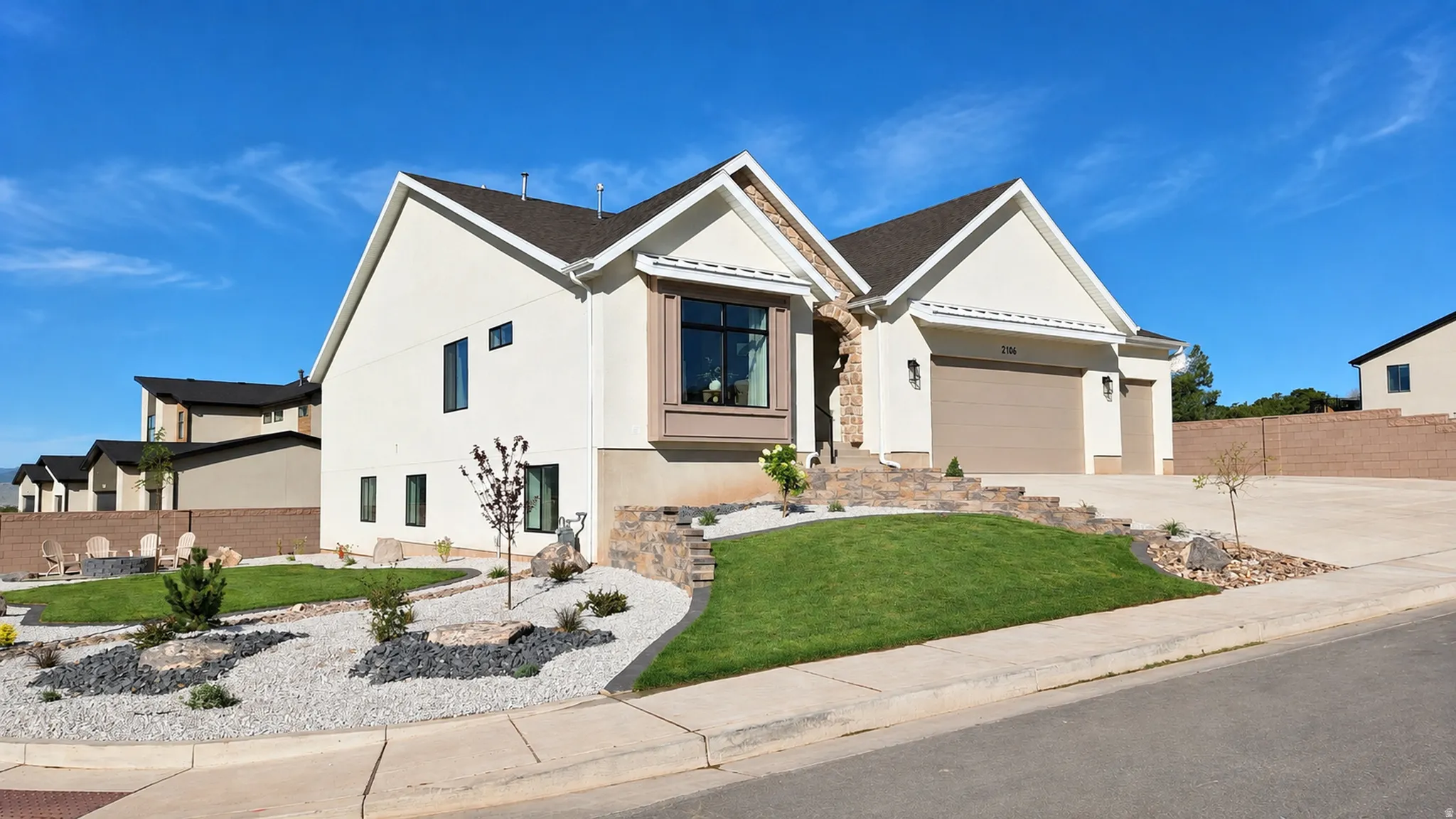 Contemporary stucco exterior with stone accents