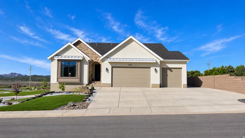 *Photos are of a previously completed home with the same or similar floor plan and are provided for reference only. This home has not yet been built. Actual finishes, colors, features, and specifications may vary.*Stucco exterior with stone accents, dua