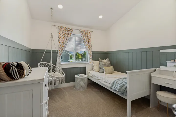 Vaulted ceilings with recessed lighting, integrated window blinds, and two-tone wall paneling