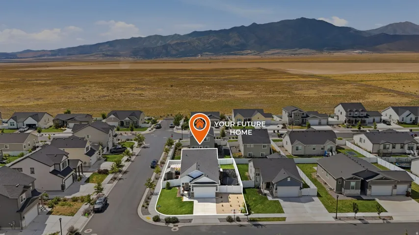 Modern residential street with uniform homes and paved sidewalks