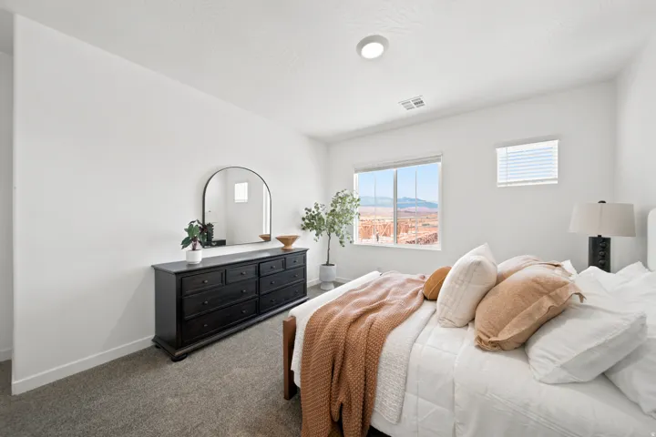 Carpeted flooring, white walls, recessed ceiling light, window blinds, and a landscape window