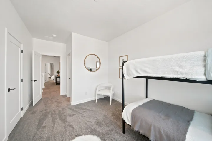 White walls with dark trim, recessed lighting, and carpeted flooring