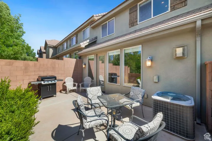 Private patio space featuring a concrete surface and perimeter wall