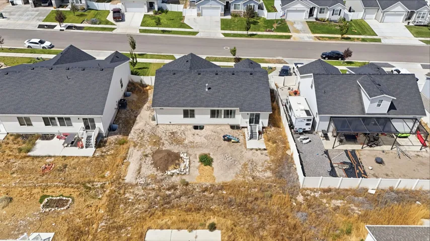 Rear exterior featuring a concrete patio and a private backyard space