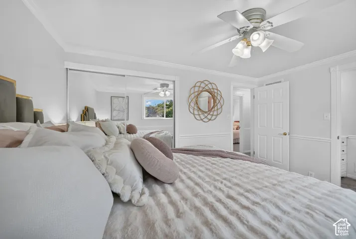 Primary bedroom with sliding mirrored closet doors