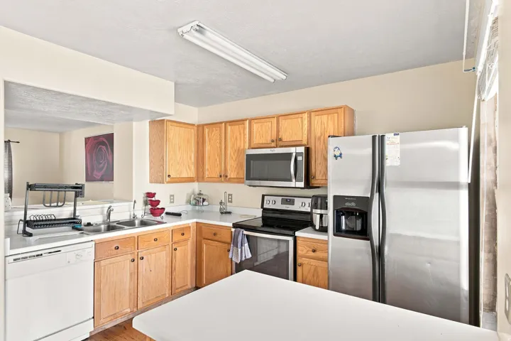 Wood-finish cabinetry paired with white countertops