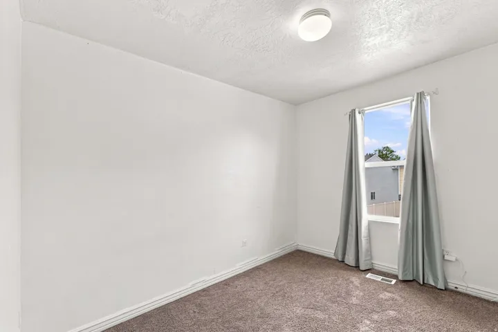 Textured carpeting and neutral wall tones