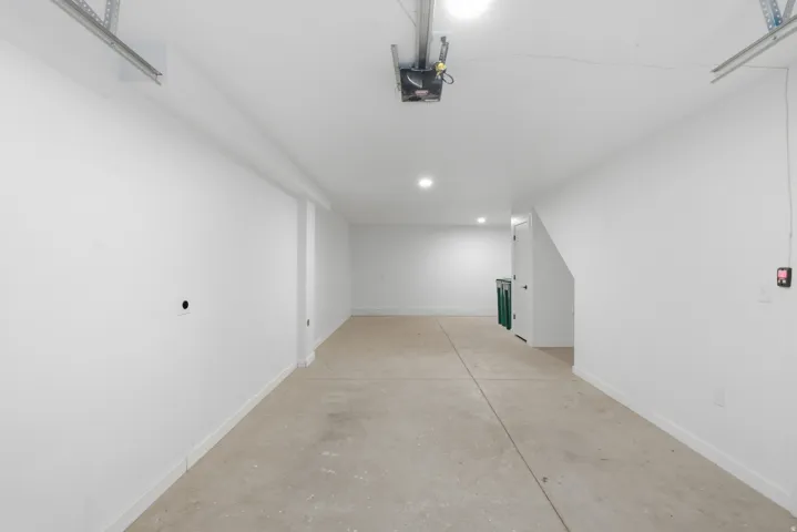 Concrete flooring with a white painted perimeter