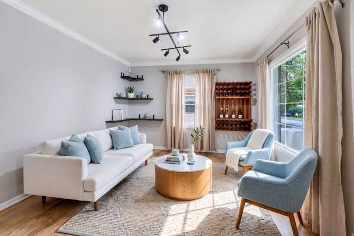 Recessed lighting, wood-finish flooring, crown molding, a built-in corner shelving unit, and a built-in wall-mounted wine rack