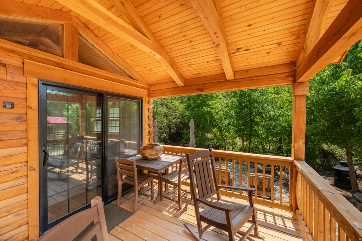 Expansive wood-plank deck featuring a natural wood railing
