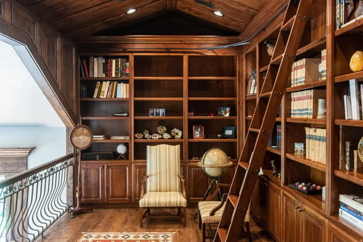 Rich wood-paneled walls and ceiling