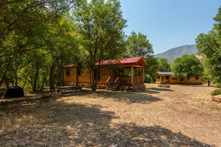 Wood-sided cabins with red metal roofs