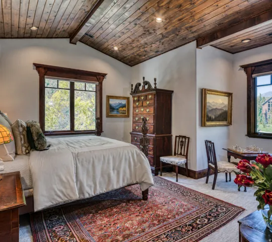 Vaulted wood-paneled ceiling with recessed lighting