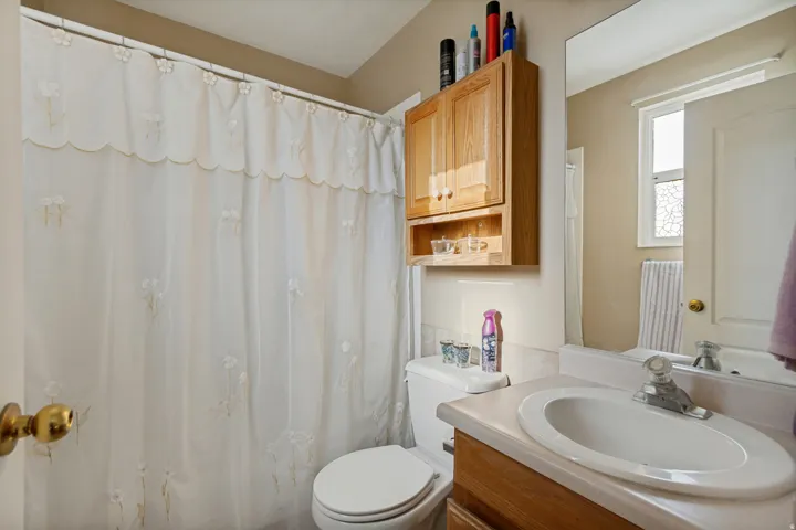 Vanity with integrated sink and chrome faucet