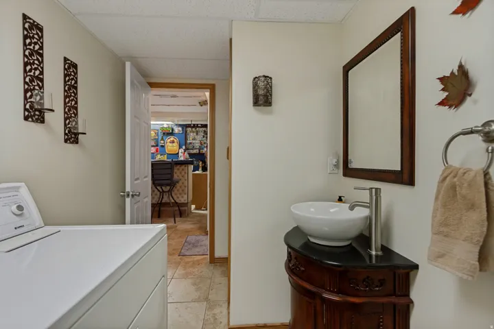 Laundry area featuring a top-load washer