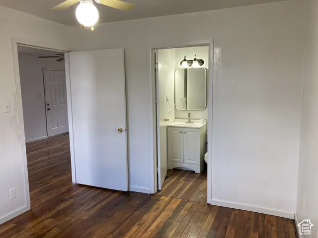 Wood-finish flooring throughout, with a ceiling fan light fixture