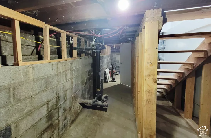 Exposed wood framing and concrete block foundation walls