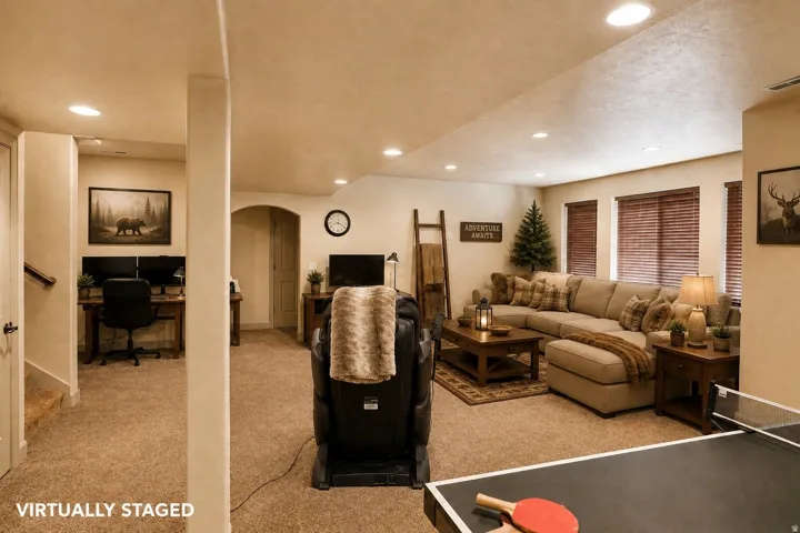 Recessed lighting, wood-finish window blinds, and carpeted flooring