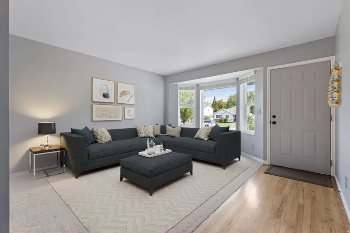 Bay window with multiple panels, wood-finish flooring, and light gray wall paint
