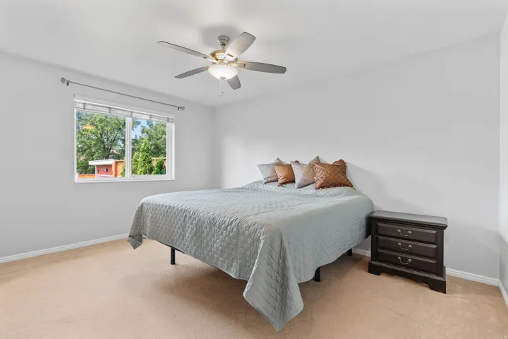 Neutral-toned walls complement plush carpeting