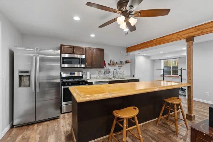 Wood-finish flooring with a wood accent beam and column