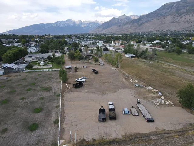 Expansive property featuring mountainous terrain, surrounding urban development, and open land