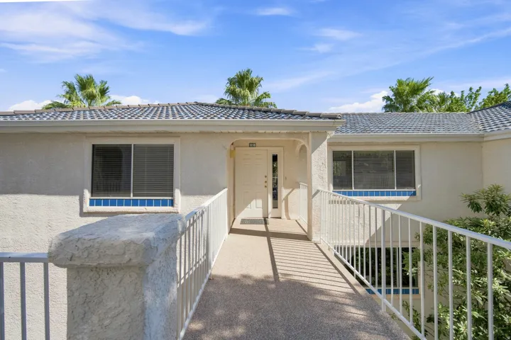 Stucco exterior with a tiled roof