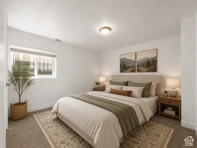 White walls and neutral carpet create a bright interior