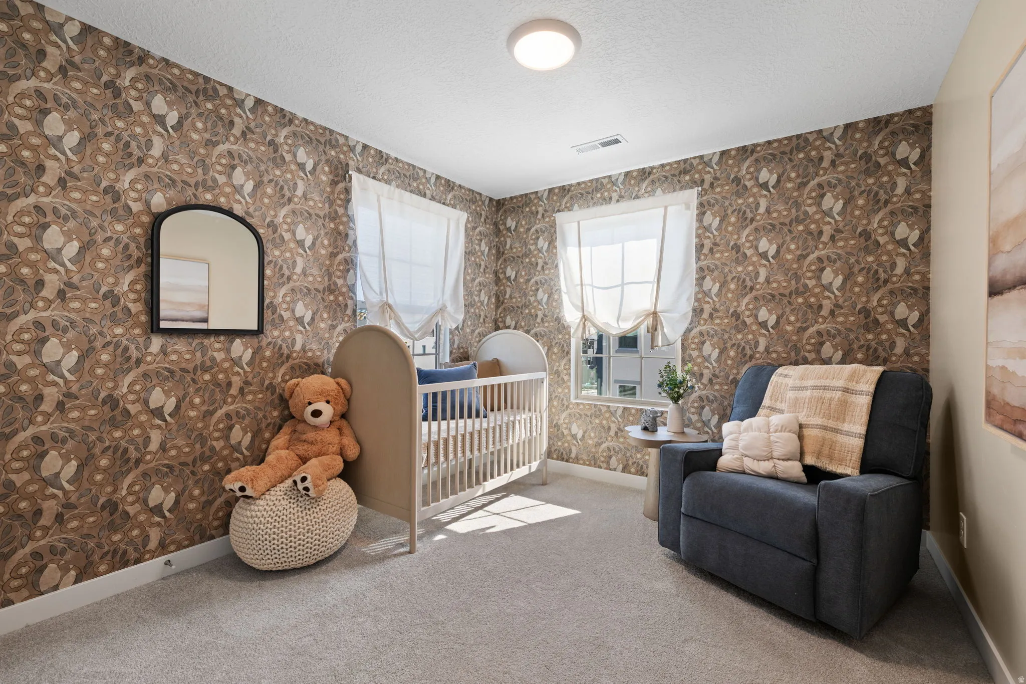 Wall-to-wall carpeting, decorative wallpaper, recessed lighting fixture, and window with blinds