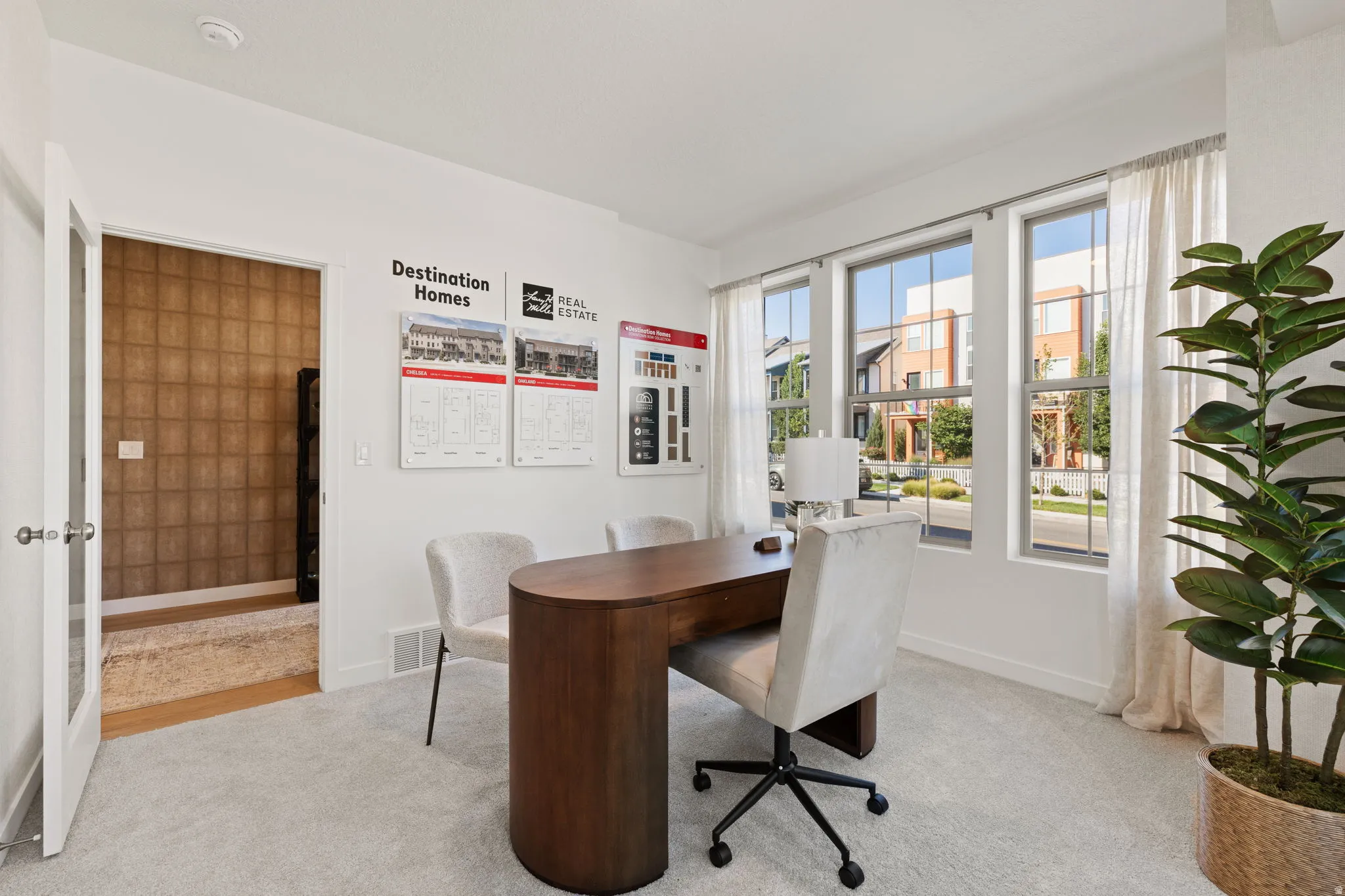 Carpeted room with multiple windows, providing ample natural light