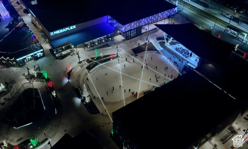 Centralized outdoor plaza featuring an ice skating rink, an amphitheater, and multiple commercial buildings