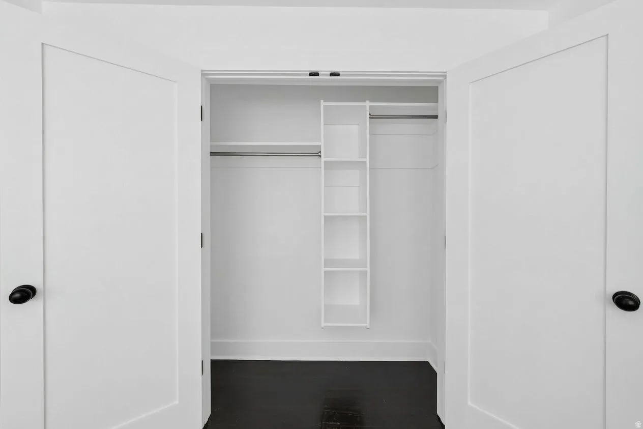 White bi-fold doors with matte black hardware