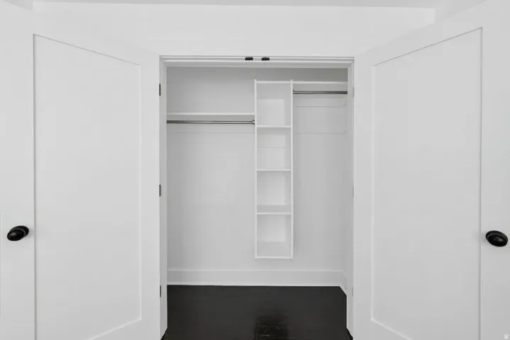 White bi-fold doors with matte black hardware