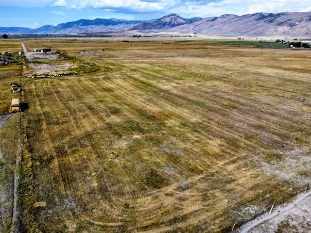 Expansive rural acreage with distant mountain ranges