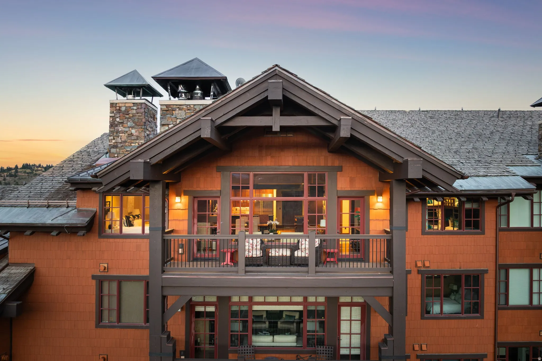 Multi-level facade featuring wood shake siding and dark trim