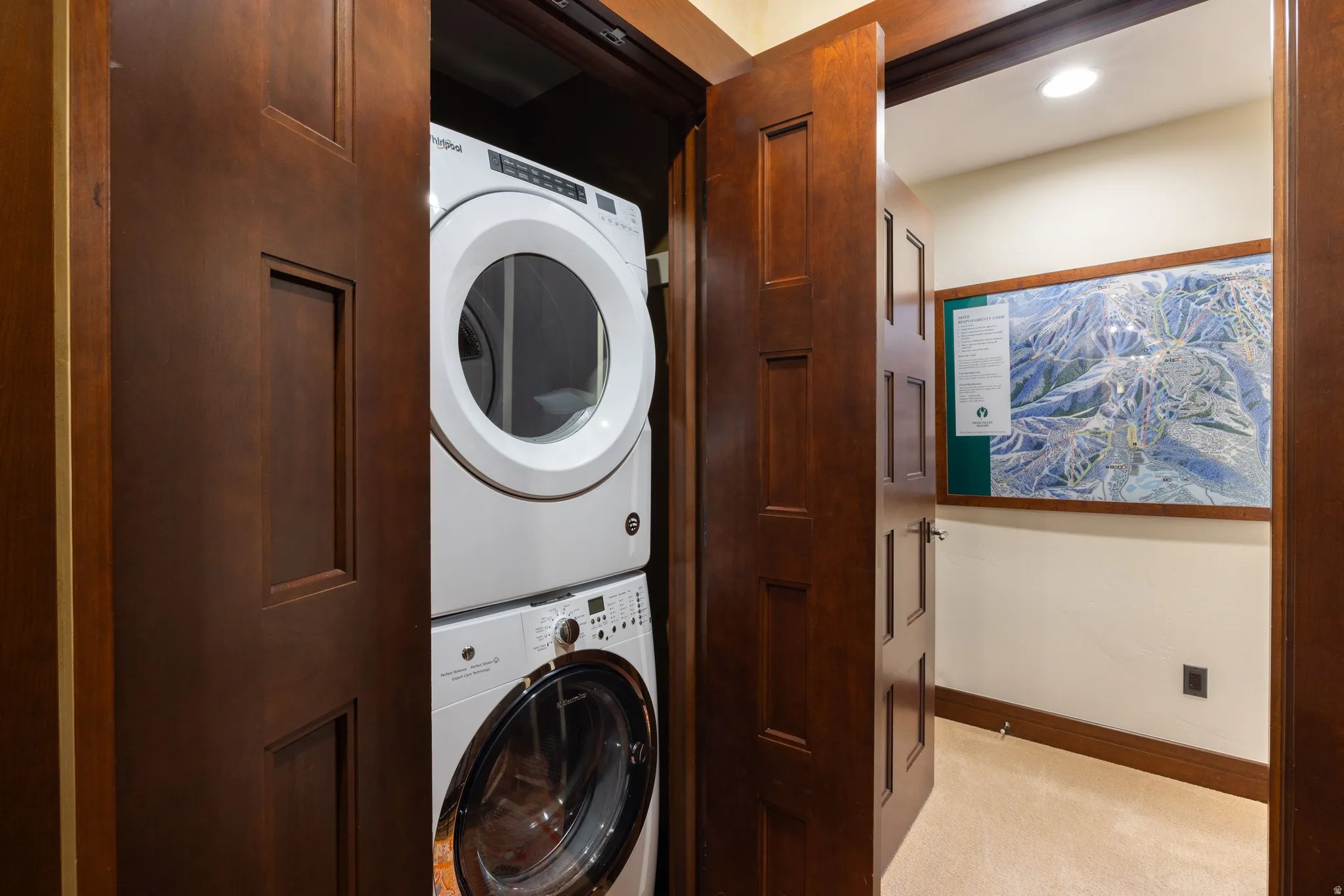 Stackable washer and dryer within a dedicated utility closet
