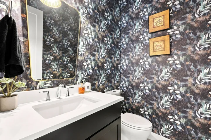 Built-in vanity with a rectangular undermount sink, chrome faucet, and white countertop