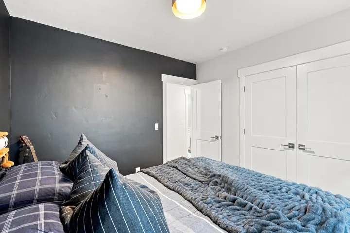 Integrated ceiling light fixture, white interior doors, and modern door hardware