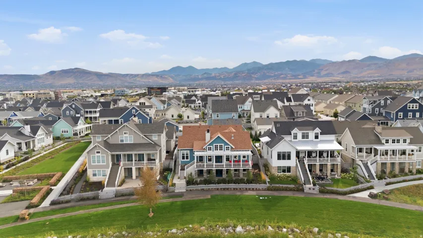 Expansive community featuring varied architectural styles and mountain backdrops