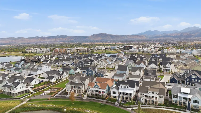 Expansive residential development with diverse architectural styles, featuring multiple lakes and green spaces
