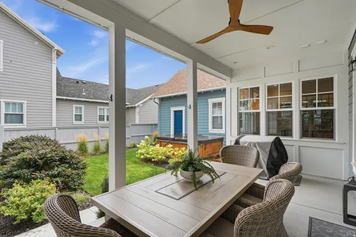 Covered patio featuring a wood ceiling fan and recessed lighting