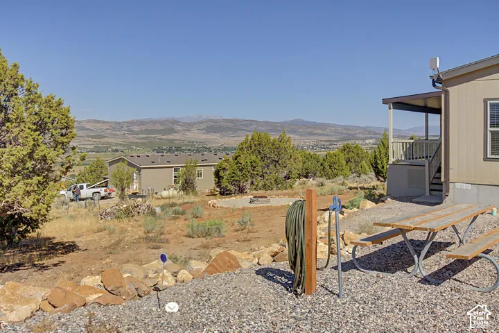 Side of yard with views and another area with hookups for guests with an RV.