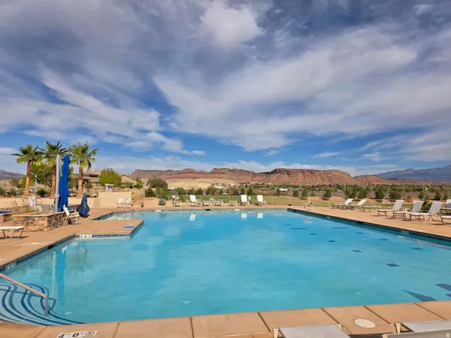 Expansive outdoor pool with integrated spa and surrounding deck