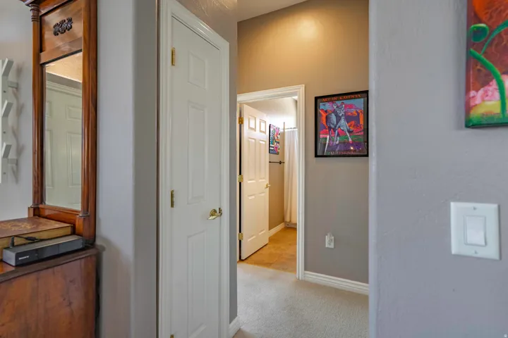 Hallway featuring neutral wall finishes, wood-finish flooring, and recessed lighting