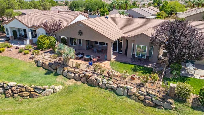 Single-story residence featuring a tile roof and stucco exterior
