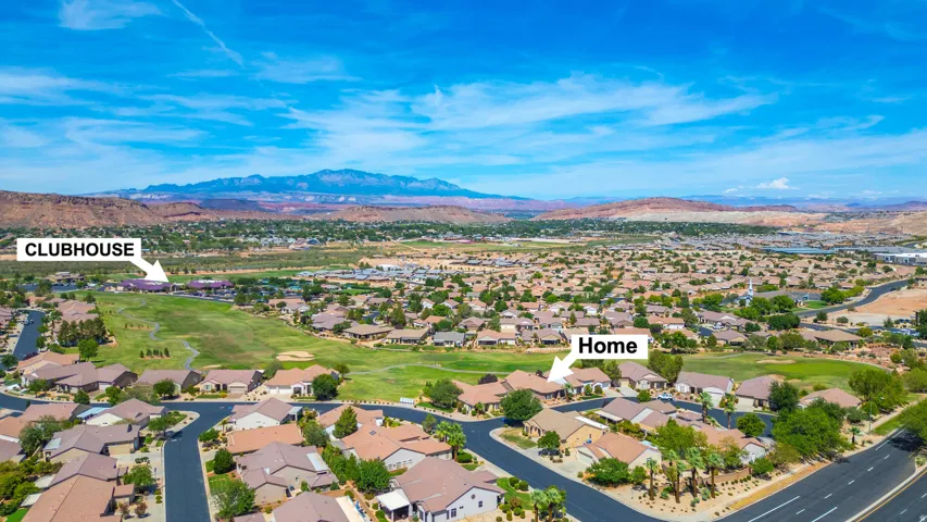 Aerial perspective of a developed residential community with golf course frontage