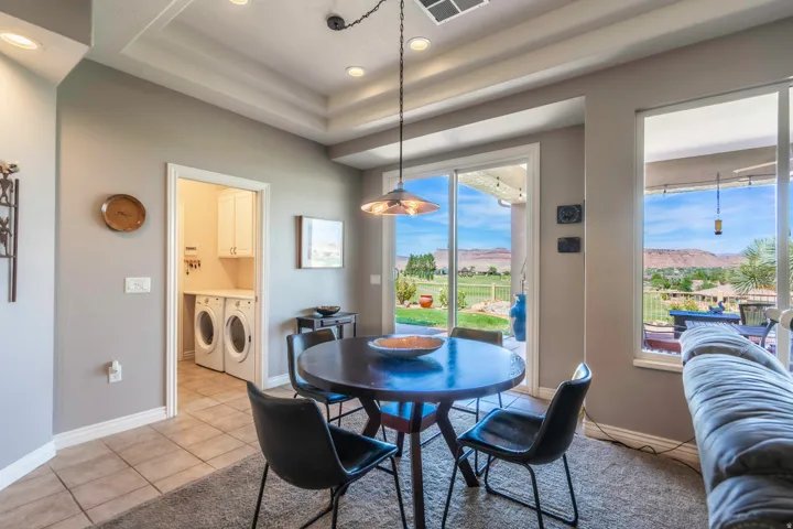 Tray ceiling with recessed lighting in great room with golf course views behind