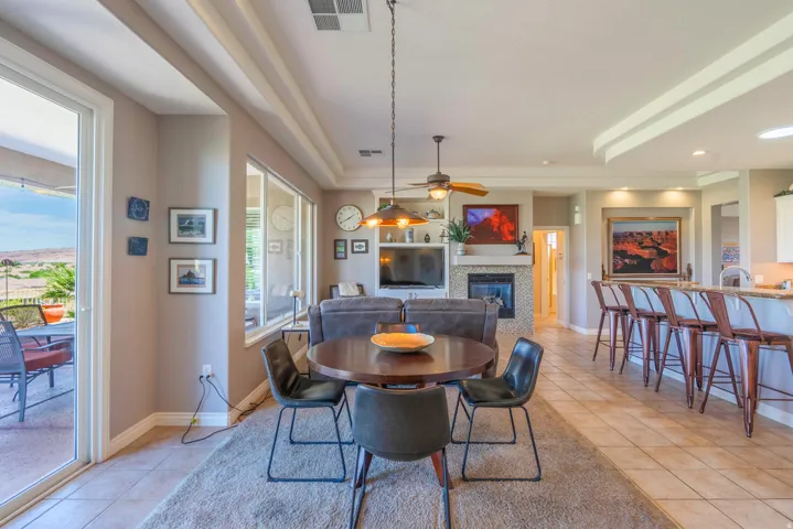 Integrated living space with a stone-clad fireplace and media built-ins